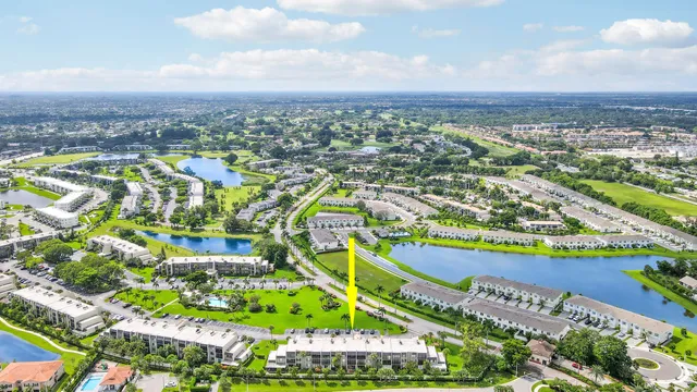 an aerial view of residential building and lake