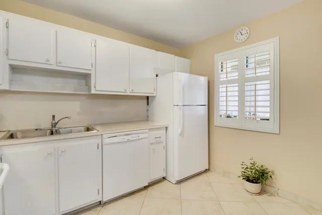 a kitchen with appliances cabinets and a sink