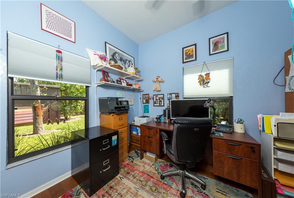 632 Hickory Road Naples, FL 34108 - Photo 12 of 20 a room with furniture and a fireplace