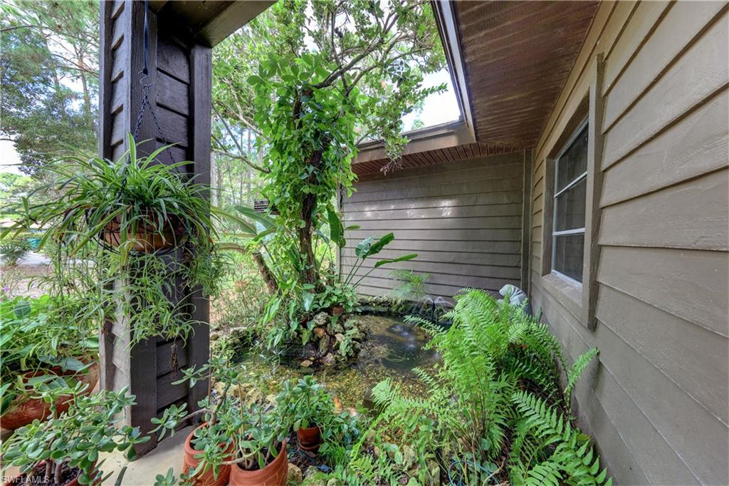 632 Hickory Road Naples, FL 34108 - Photo 17 of 20 a backyard of a house with lots of green space