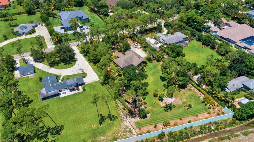 632 Hickory Road Naples, FL 34108 - Photo 19 of 20 an aerial view of residential houses with outdoor space and trees