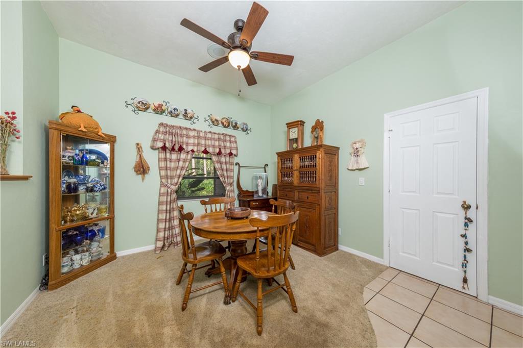 632 Hickory Road Naples, FL 34108 - Photo 6 of 20 a dining room with furniture and window