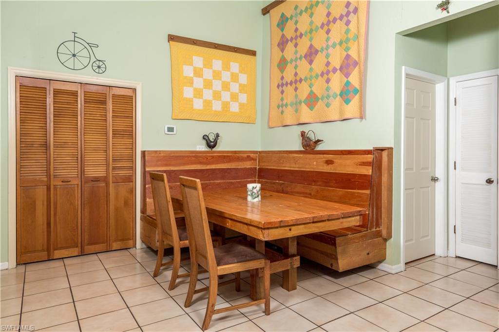 632 Hickory Road Naples, FL 34108 - Photo 7 of 20 a dining room with furniture and window