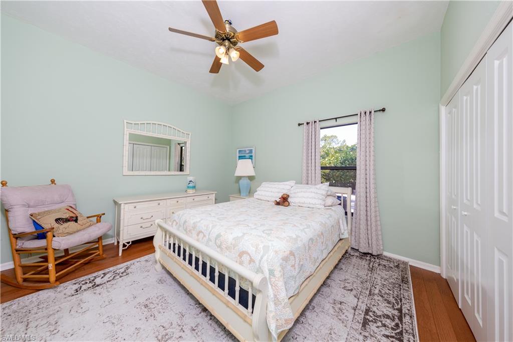 632 Hickory Road Naples, FL 34108 - Photo 9 of 20 a bedroom with a bed and a window