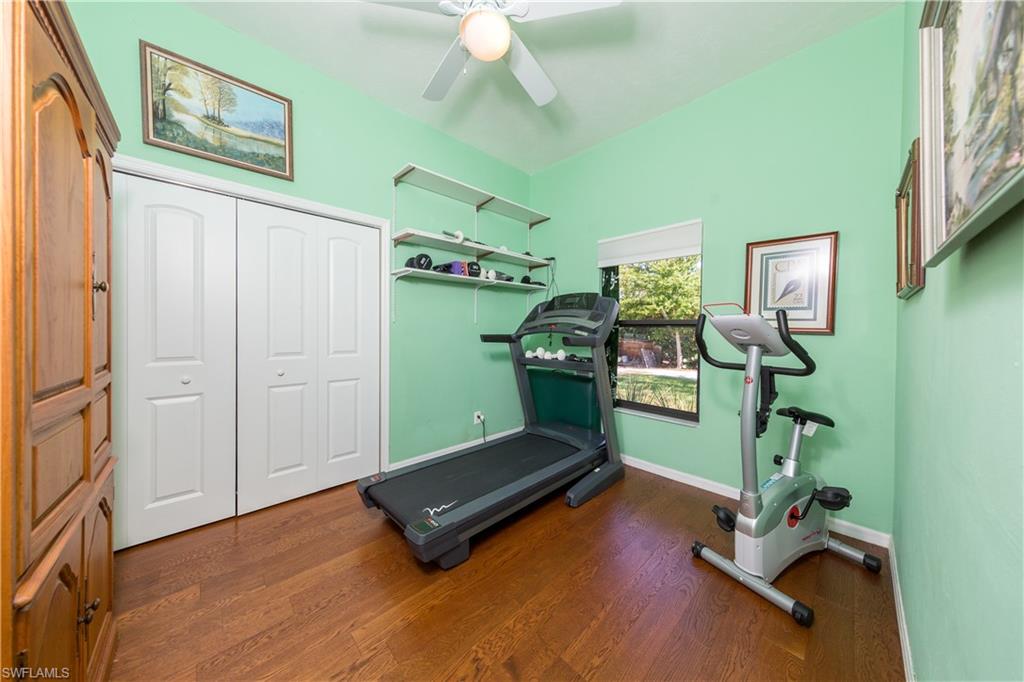632 Hickory Road Naples, FL 34108 - Photo 10 of 20 a room with gym equipment and windows