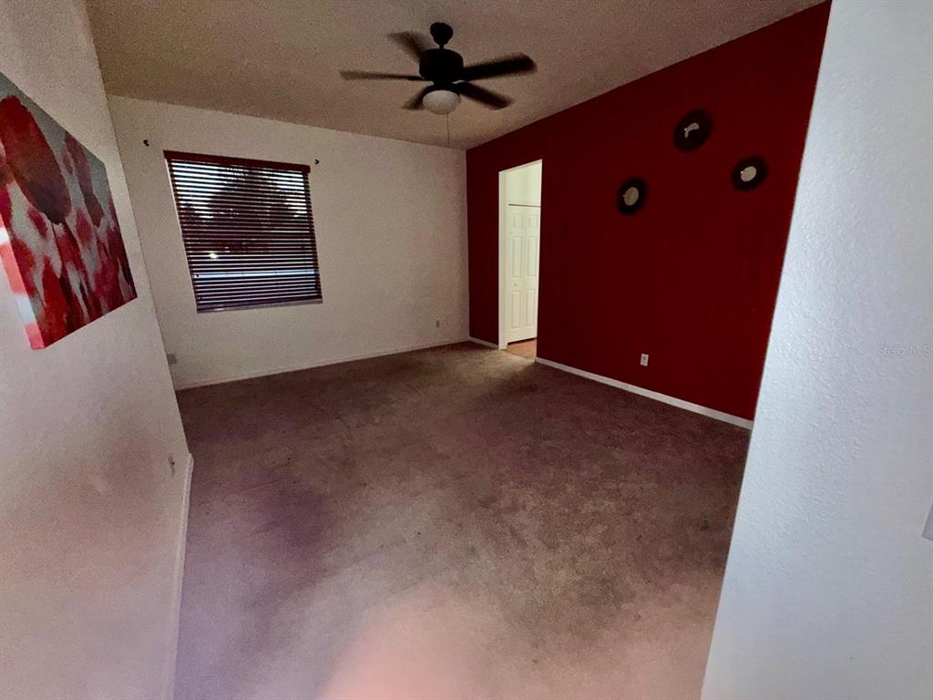 2716 Randal Way Kissimmee, FL 34743 - Photo 13 of 15 a view of an empty room with ceiling fan