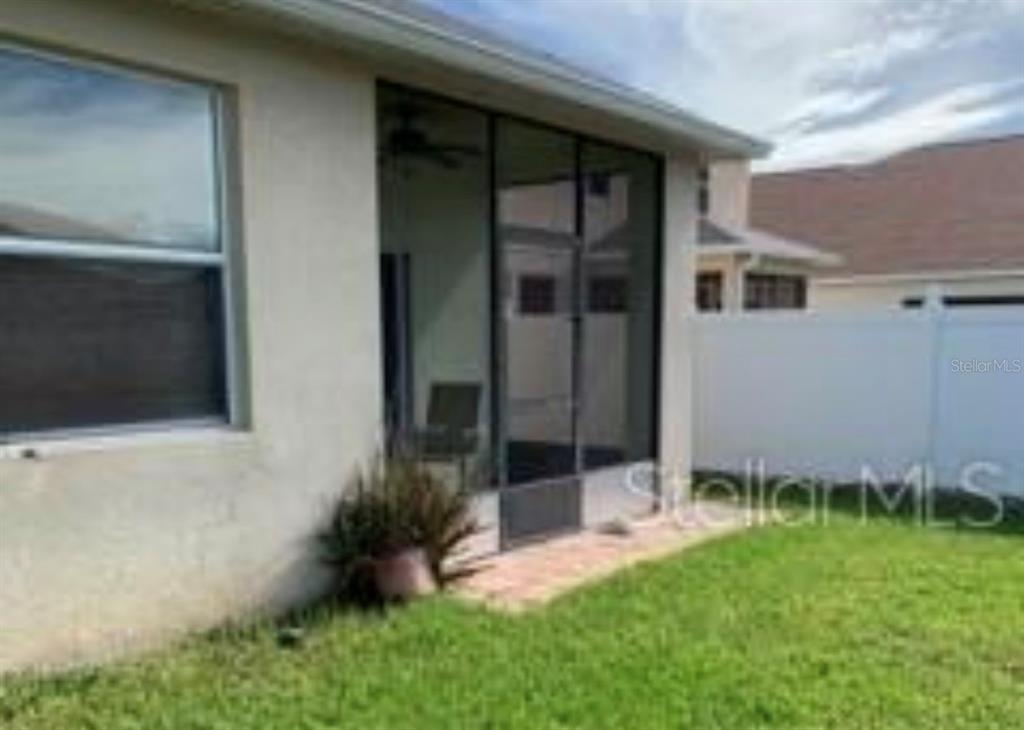 2716 Randal Way Kissimmee, FL 34743 - Photo 13 of 13 a view of house with backyard