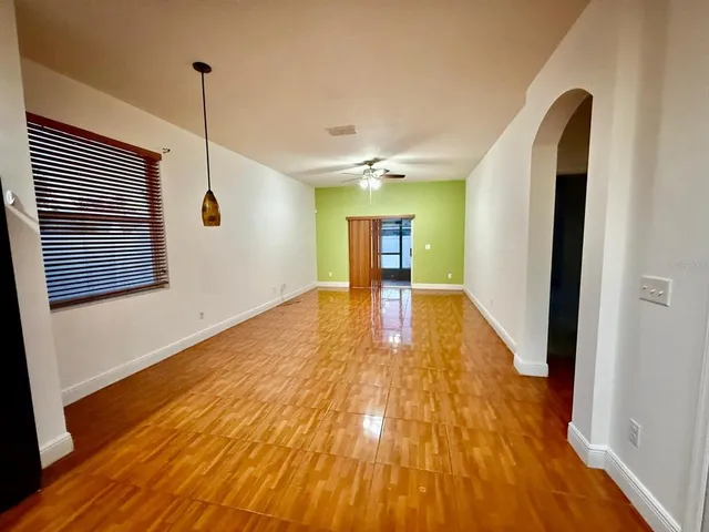 a view of an entryway with wooden floor