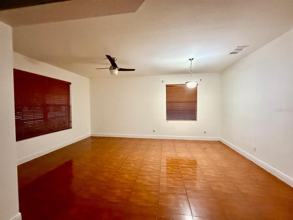 2716 Randal Way Kissimmee, FL 34743 - Photo 5 of 15 a view of an empty room with a window