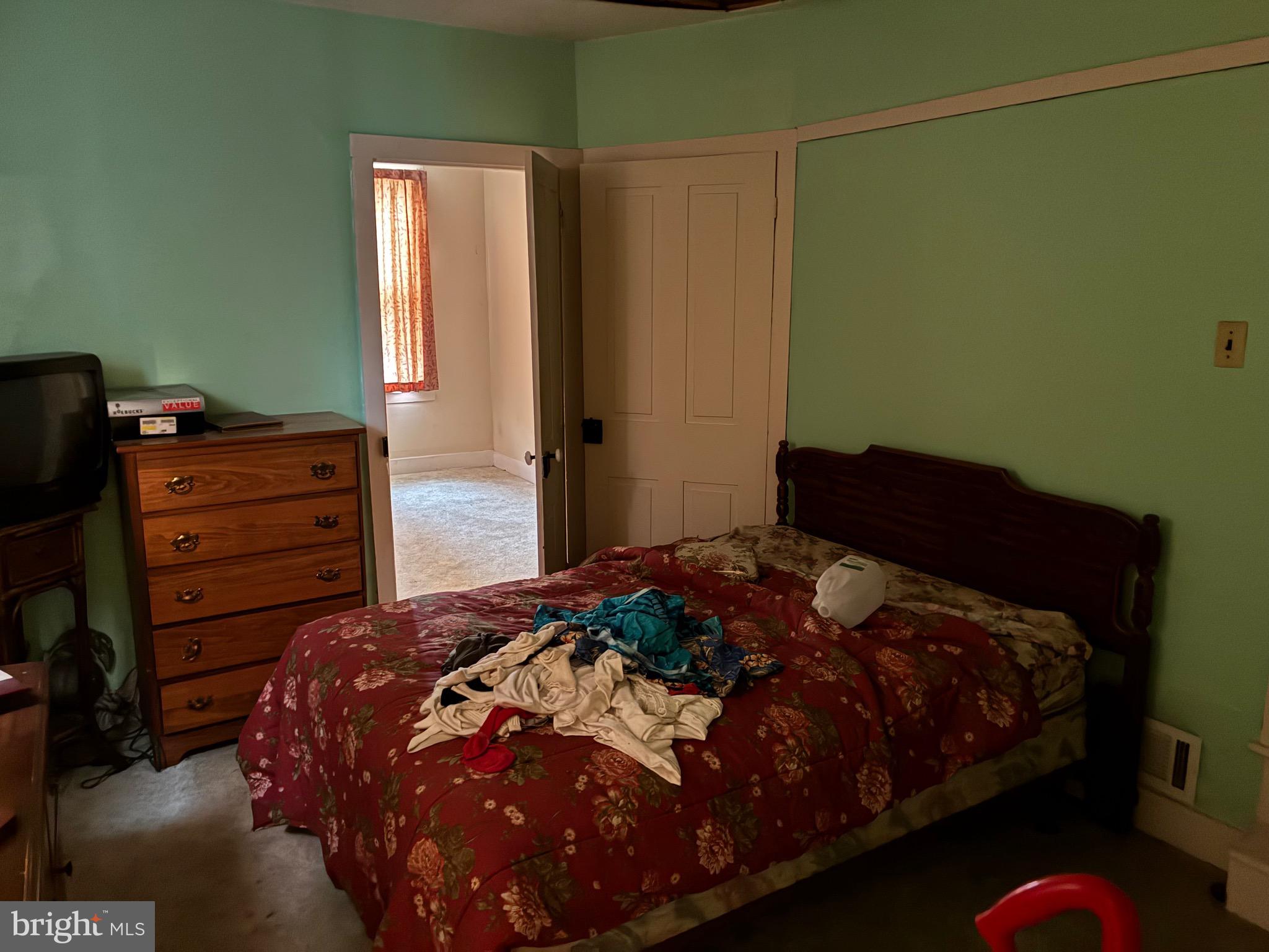 222 Main Street Denver, PA 17517 - Photo 12 of 32 a bedroom with a bed and a dresser