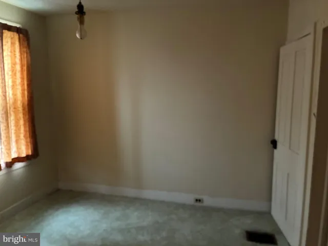 a room that has a window and chair