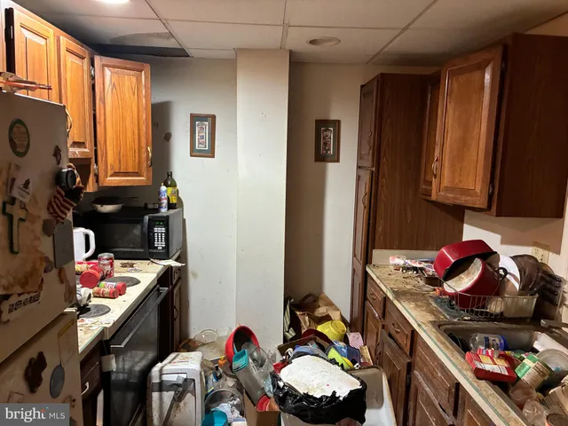 a kitchen with a stove and a refrigerator