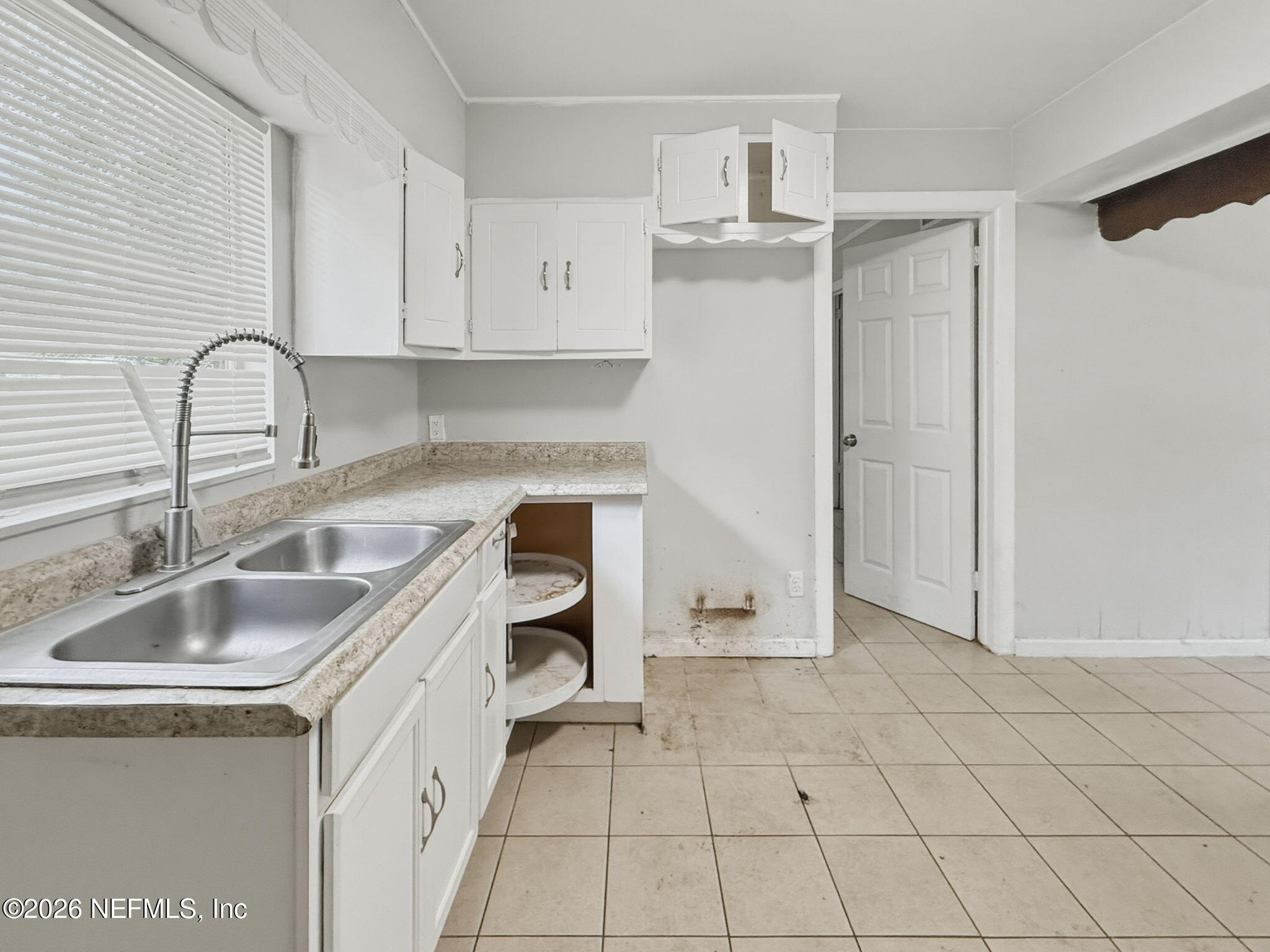 326 Cahoon Road South Jacksonville, FL 32220 - Photo 13 of 34 a kitchen with stainless steel appliances granite countertop a sink and a refrigerator
