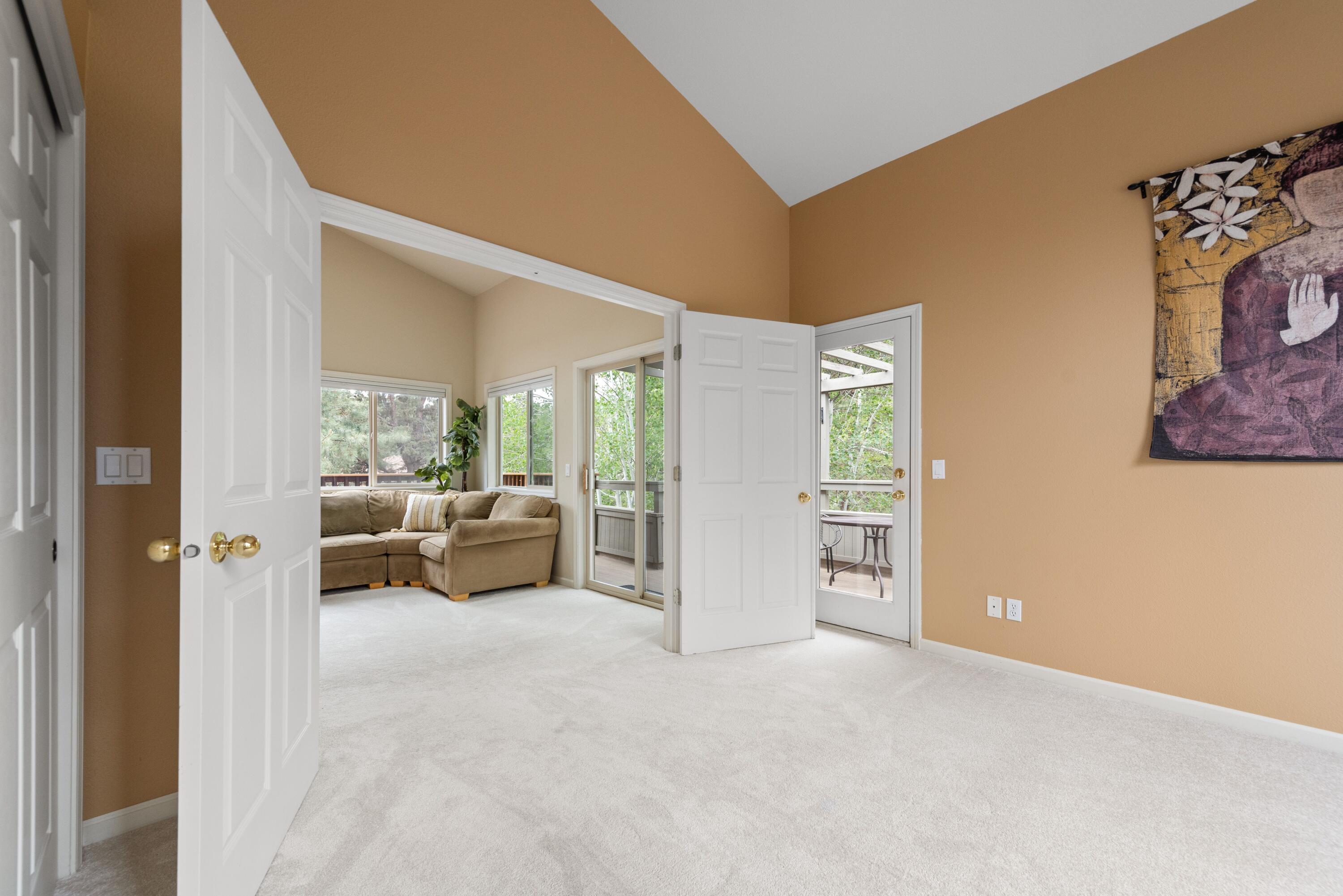 2255 Northwest Putnam Road Bend, OR 97703 - Photo 21 of 49 The second bedroom off the family room has double doors plus an exterior door out to the side deck.