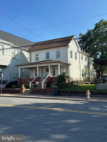 a view of a car park front of house