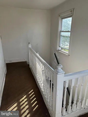 a view of hallway with stairs