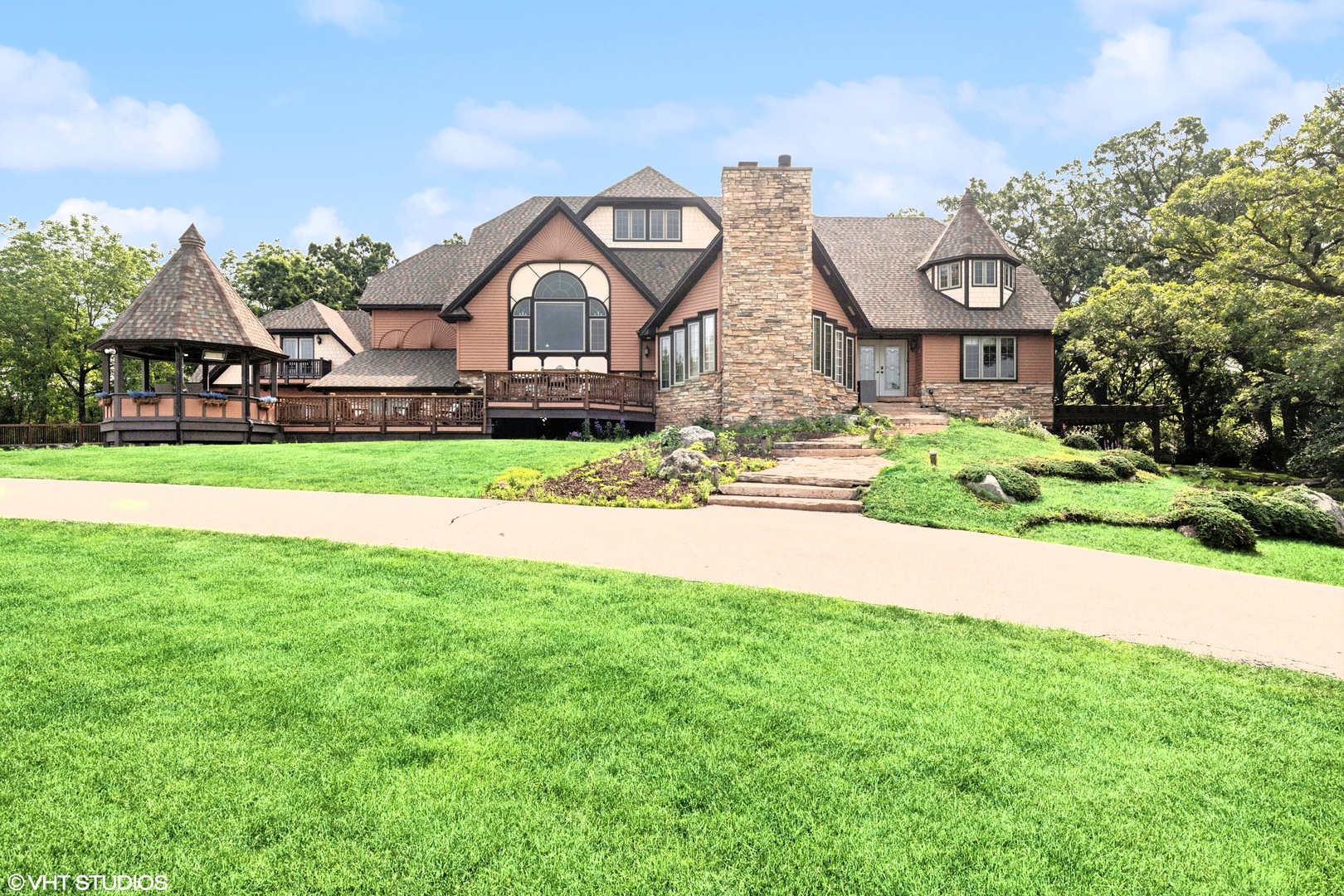 a front view of house with yard and green space