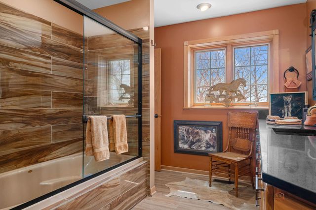 a bedroom with a bed window and couch