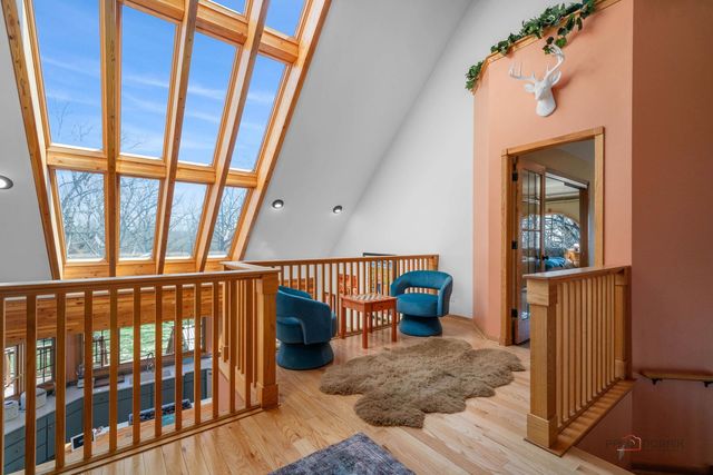 a bedroom with two beds and window
