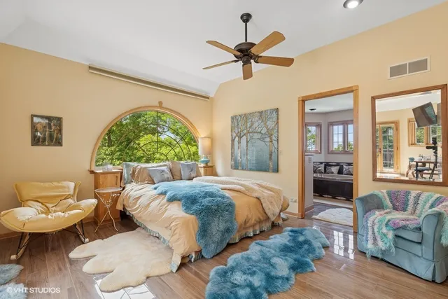 a backyard of a house with yard table and chairs