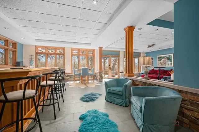 a view of a house with backyard porch and sitting area