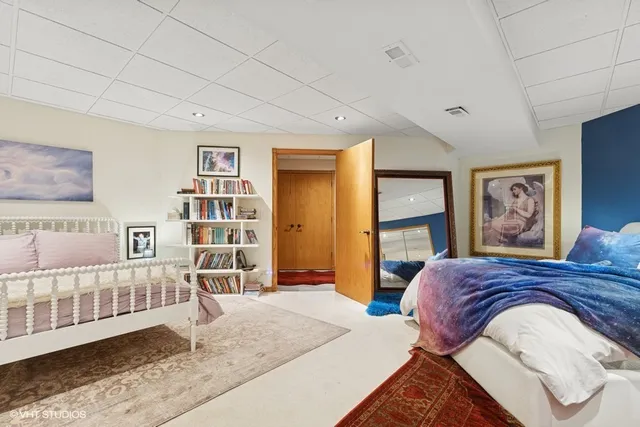 a view of a pathway both side of grassy field with shrub