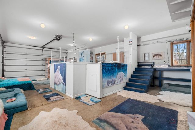 a roof deck with couches and wooden fence