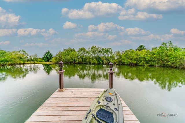 a view of a lake with a yard