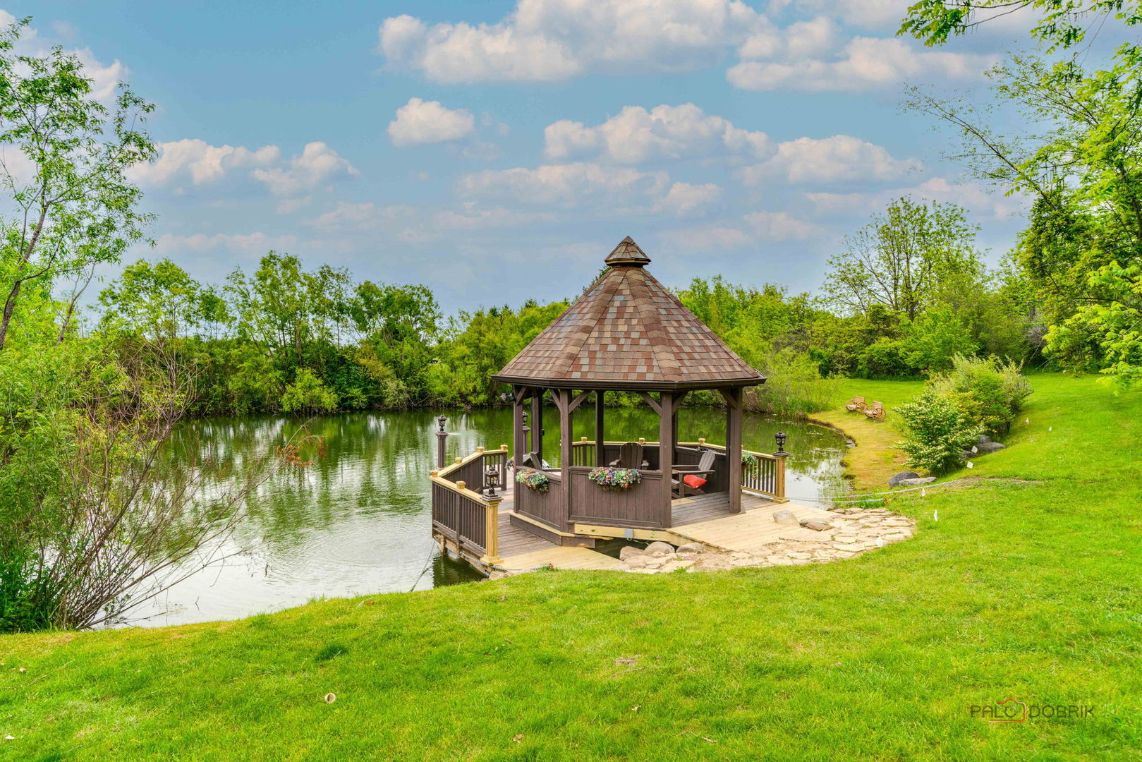 20719 Highview Road Marengo, IL 60152 - Photo 39 of 62 a backyard of a house with yard table and chairs