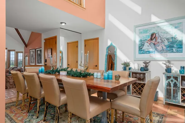 a living room with furniture a rug and a chandelier