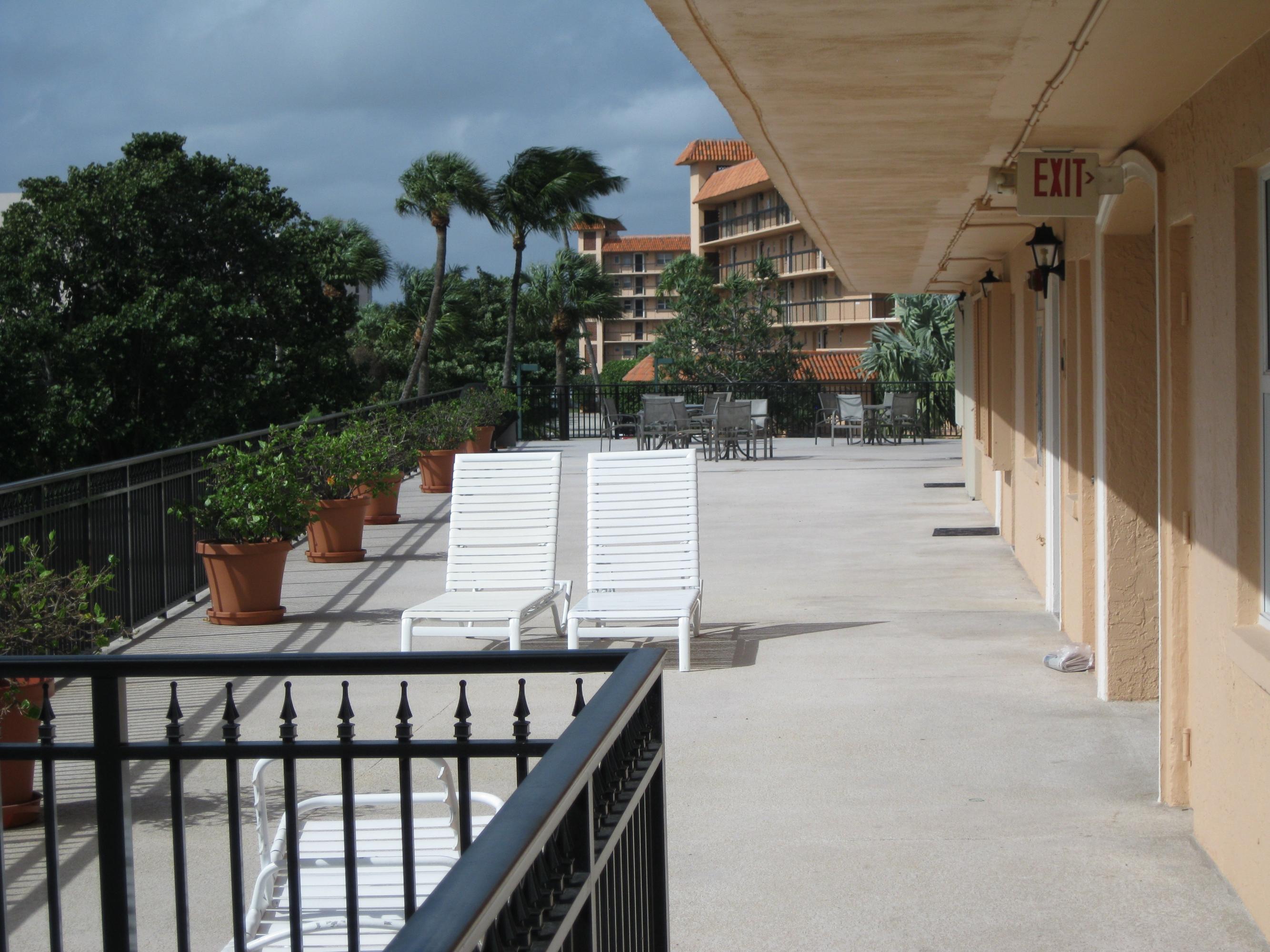 2871 North Ocean Boulevard, Unit D110 Boca Raton, FL 33431 - Photo 3 of 14 FRONT ENTRANCE WITH SUNNY BAR-B-QUE AREA