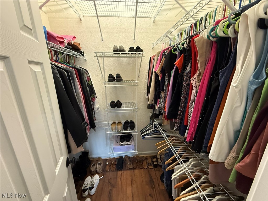 5645 Clingan Road, Unit 2D Struthers, OH 44471 - Photo 36 of 50 Spacious closet featuring wood finished floors