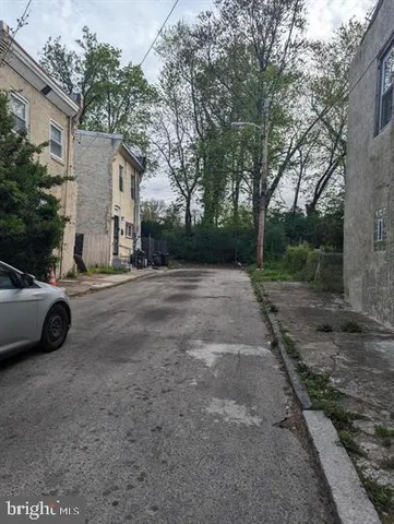 a view of a car parked in front of a house