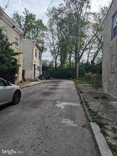 a view of a car parked in front of a house