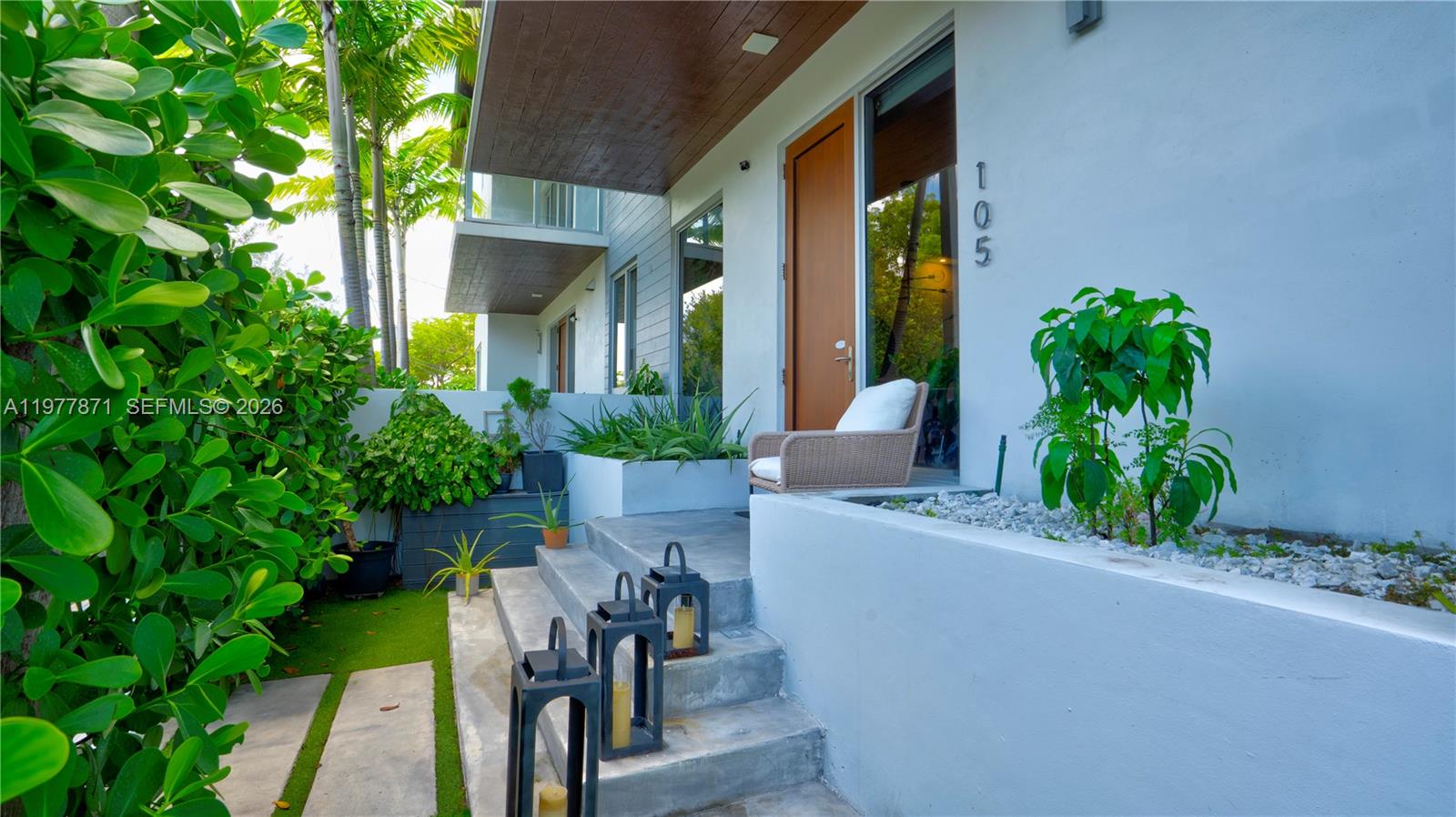 a view of an house with porch and furniture