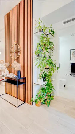 a view of a backyard with potted plants
