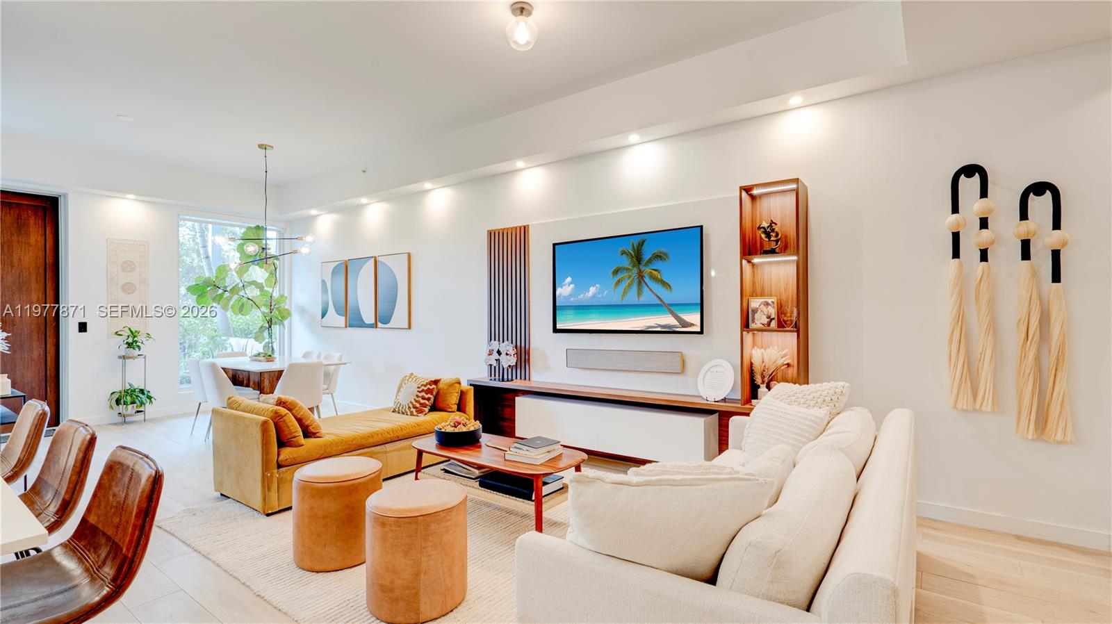 545 Southwest 11th Street, Unit 105 Miami, FL 33129 - Photo 12 of 43 a living room with furniture and a chandelier