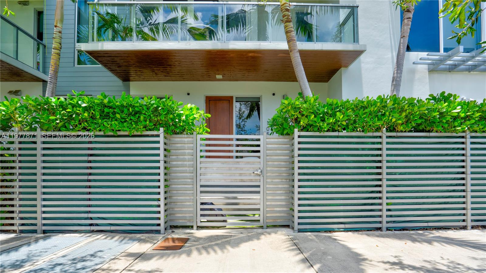 545 Southwest 11th Street, Unit 105 Miami, FL 33129 - Photo 2 of 43 a front view of a house with a yard