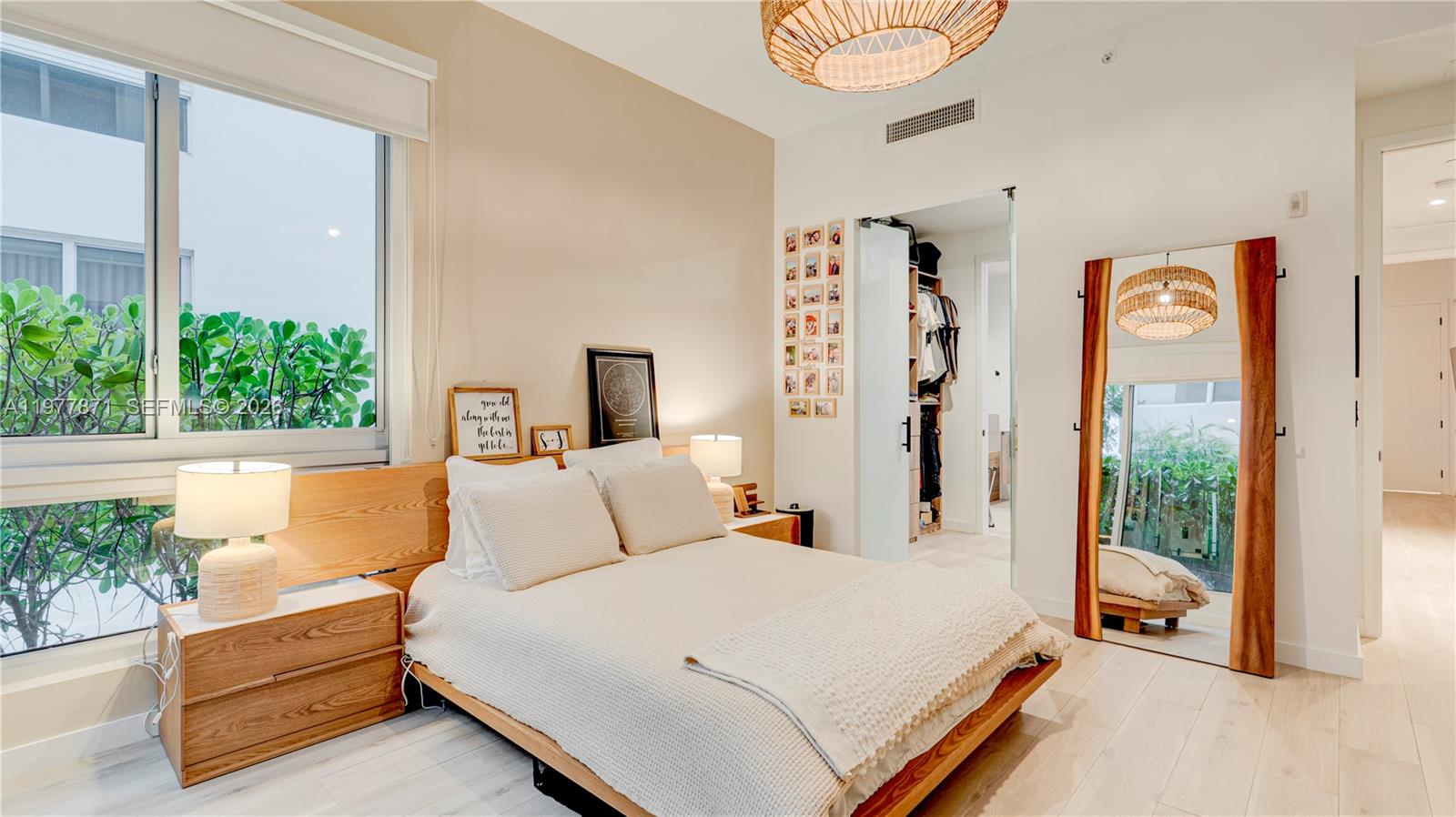 545 Southwest 11th Street, Unit 105 Miami, FL 33129 - Photo 27 of 43 a bed room with a bed and a large window