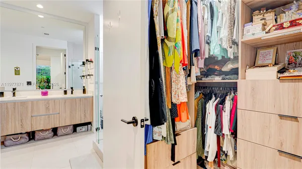 a cabinet with wine table and a book shelf