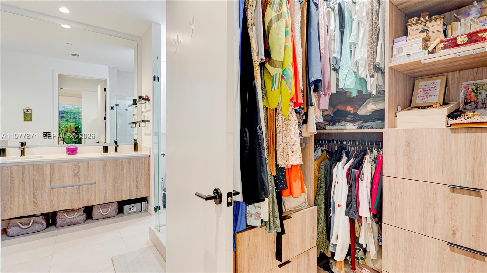 545 Southwest 11th Street, Unit 105 Miami, FL 33129 - Photo 29 of 43 a view of walk in closet with clothes and shoes