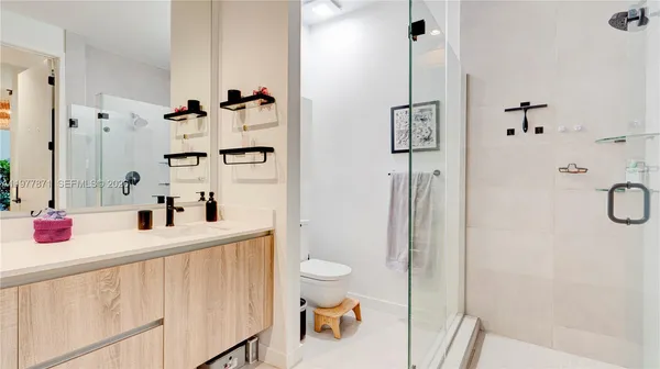 a living room with a couch and dresser