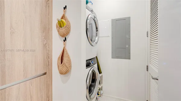 an aerial view of a house with outdoor space and sitting area