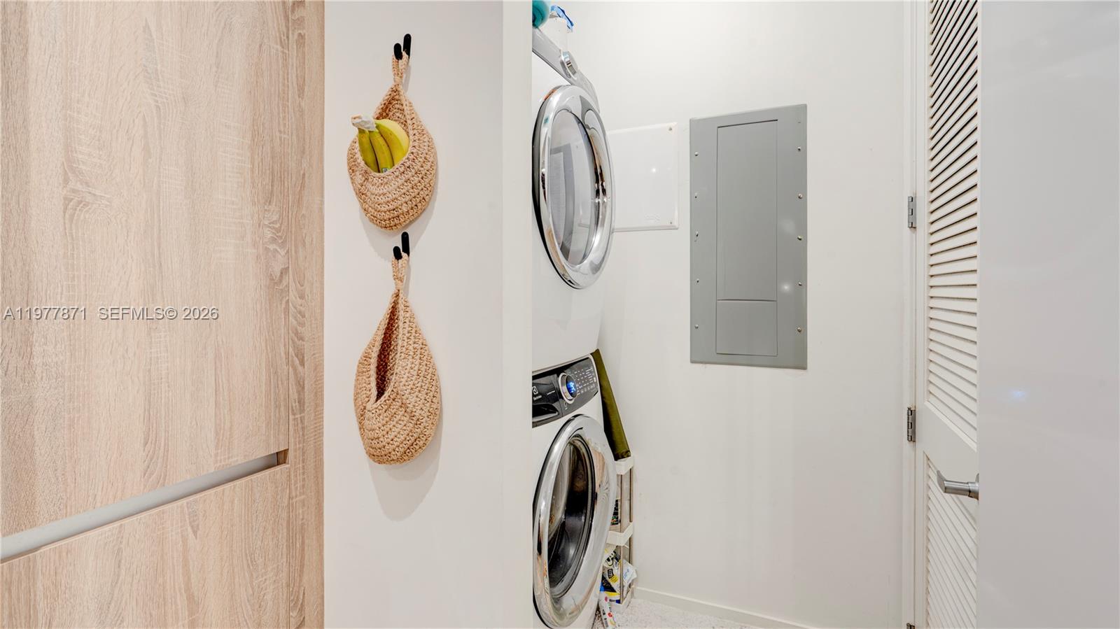 545 Southwest 11th Street, Unit 105 Miami, FL 33129 - Photo 37 of 43 a utility room with dryer and white walls