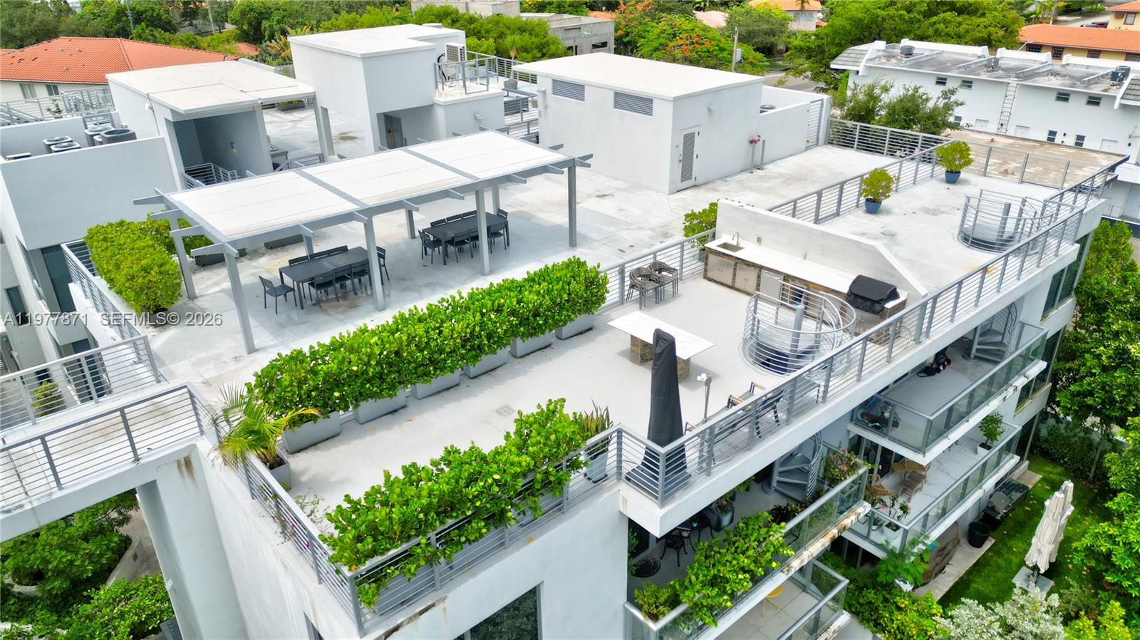 545 Southwest 11th Street, Unit 105 Miami, FL 33129 - Photo 39 of 43 an aerial view of a house with outdoor space and sitting area