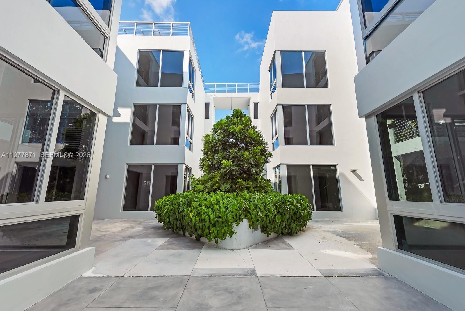 545 Southwest 11th Street, Unit 105 Miami, FL 33129 - Photo 5 of 43 a house with a window and balcony