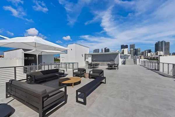 a view of a terrace with furniture