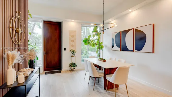 a dining room with furniture and window