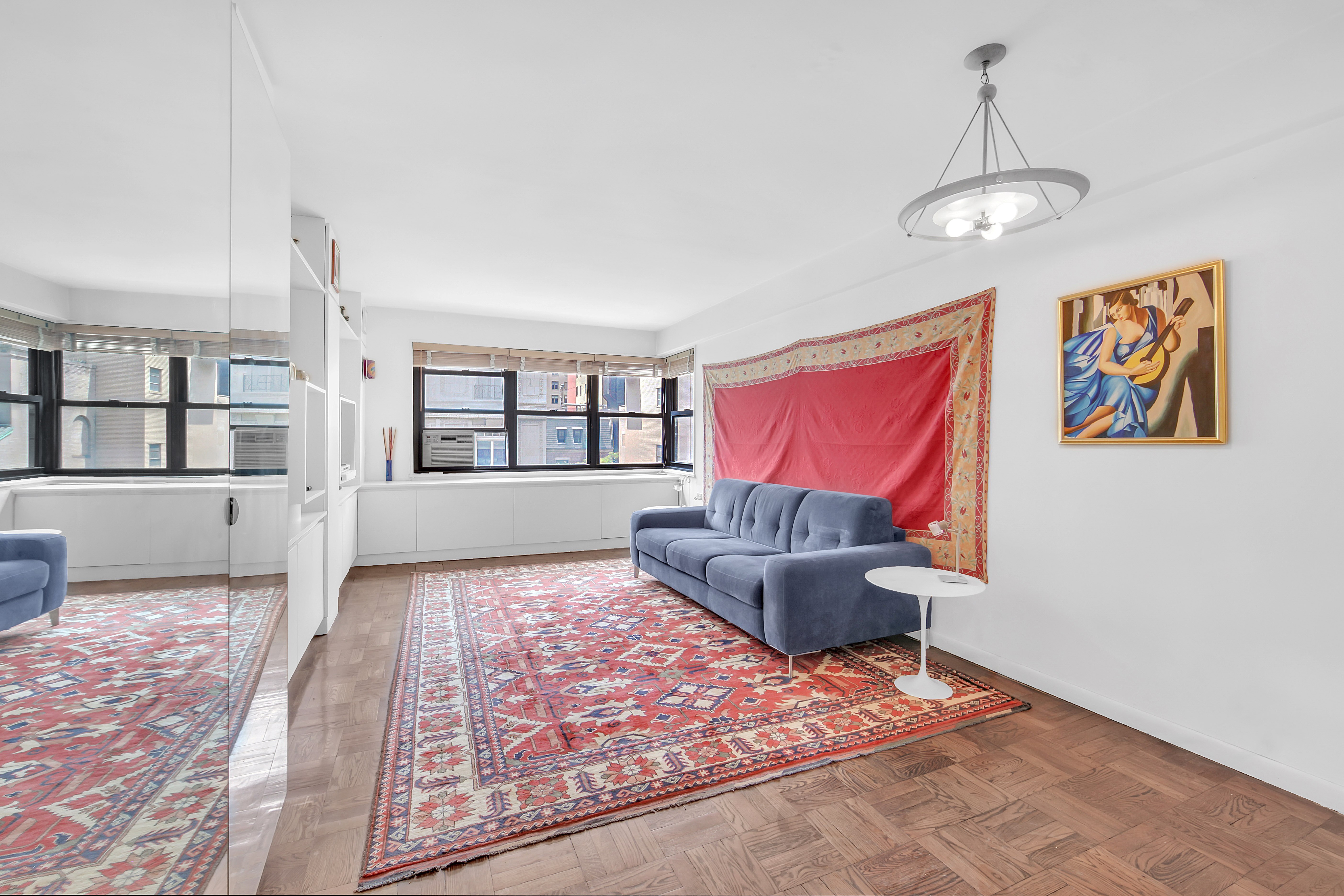 Undisclosed Address Manhattan, NY 10128 - Photo 2 of 9 a living room with furniture and a window