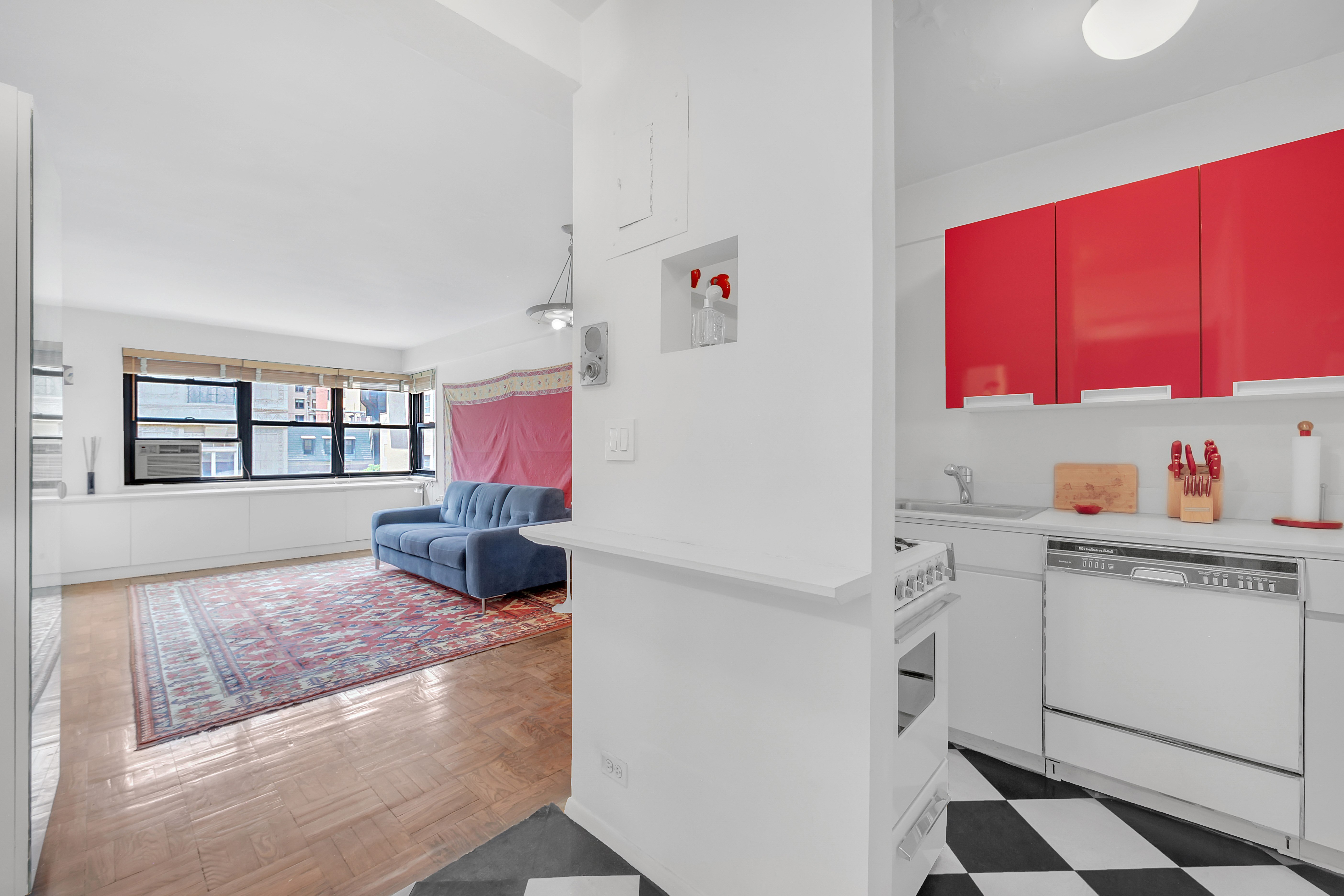 Undisclosed Address Manhattan, NY 10128 - Photo 3 of 9 a utility room with cabinets washer and dryer